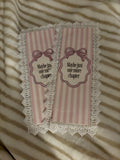 double sided pink bookmark with letters- hand-glued lace around the bookmark.♡