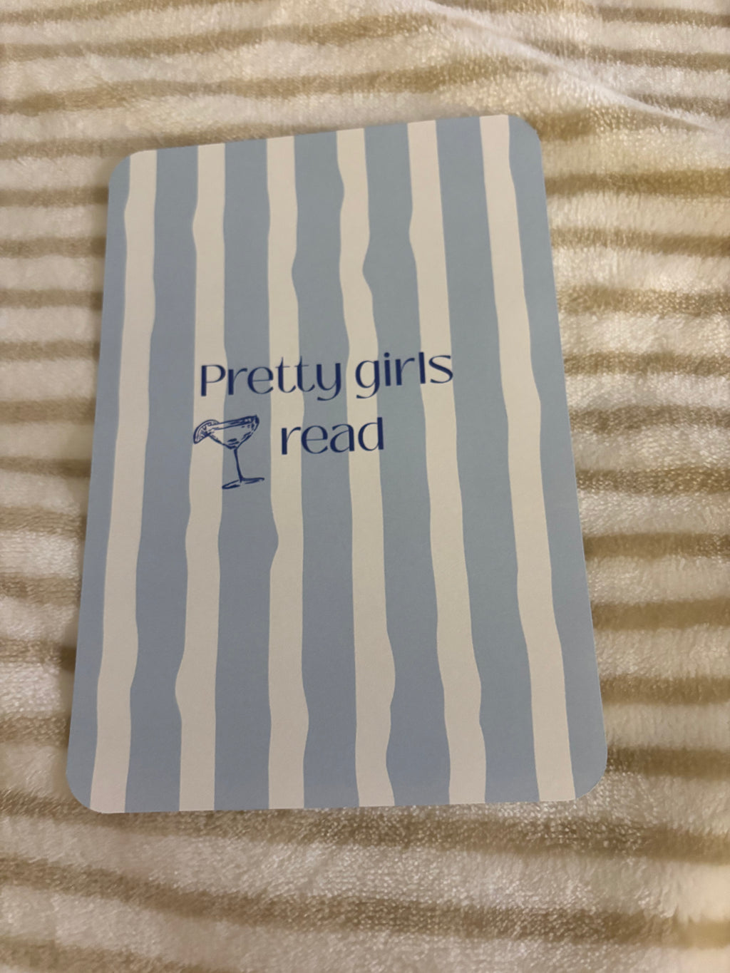 Kindle basic inserts, blue and white stripes with text.