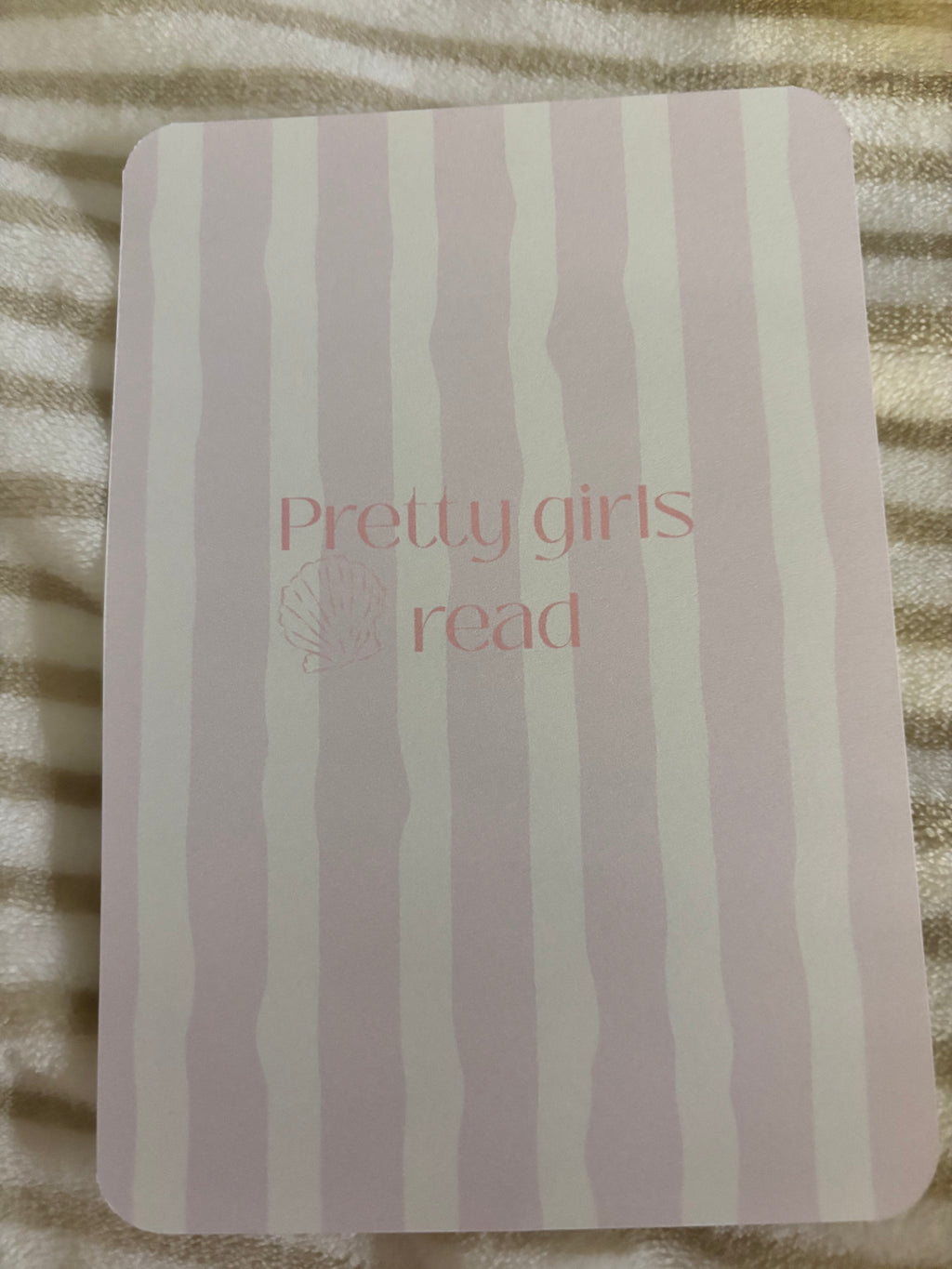 Kindle basic inserts, pink and white stripes with text.