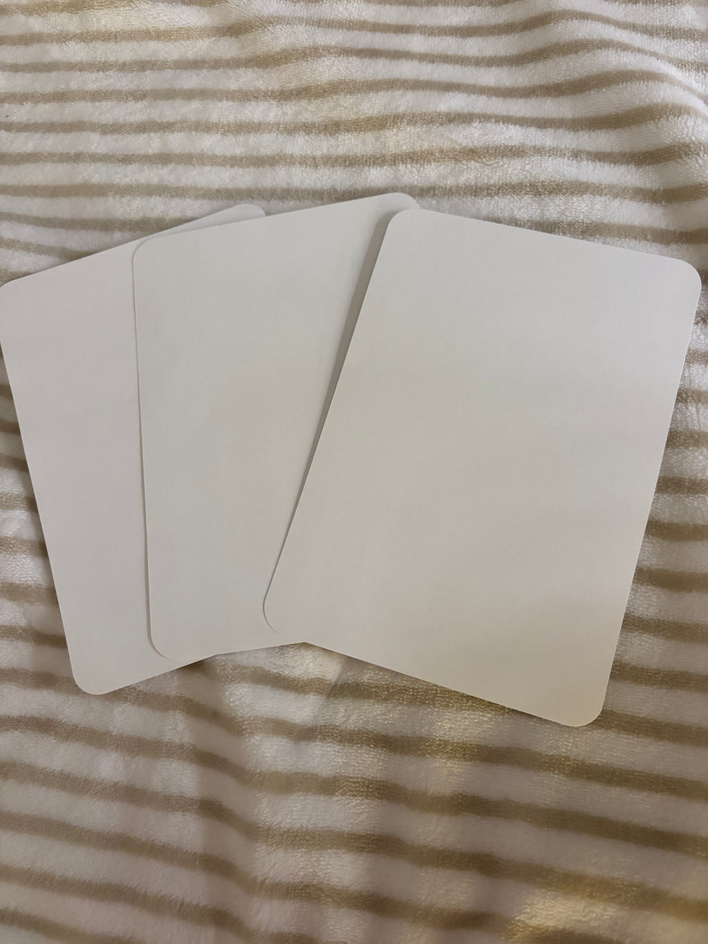 Kindle basic inserts, pink and white stripes with text.